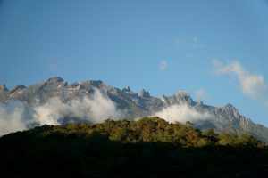 Sunrise view of Mount Kinabalu with lush forest in Sabah, Malaysia